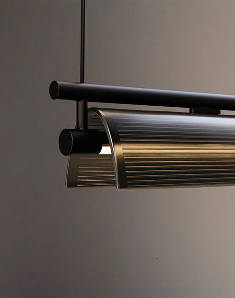Drawns suspension light hanging in a living room