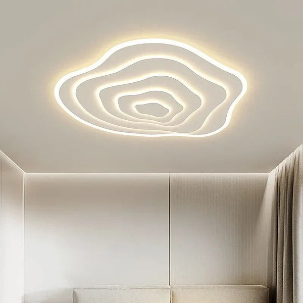 Spiral Modes ceiling light illuminated in warm light