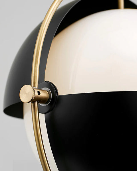Close-up of Gubi globe droplight's milky glass globe