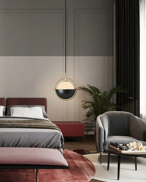 Gubi globe droplight illuminated in a living room