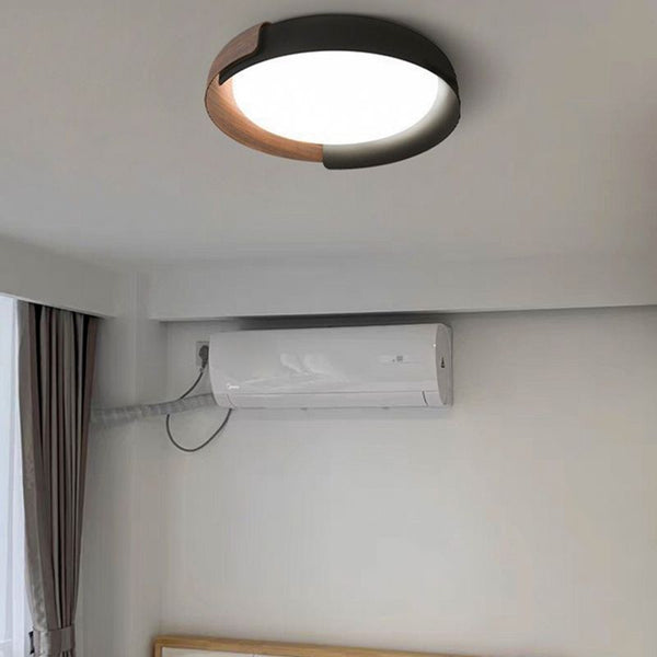 Close-up of Quinn ceiling light's black and wood finish