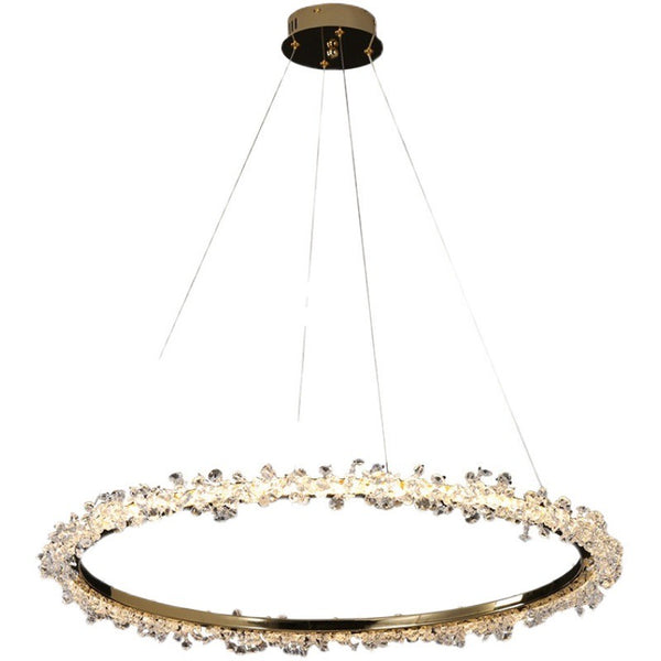 Beady gold chandelier illuminated in a living room