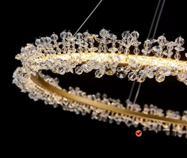 Beady gold chandelier hanging as a statement piece