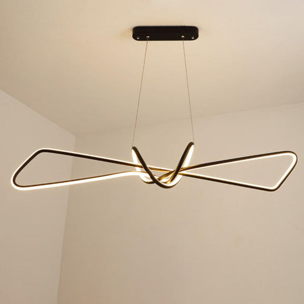 Bow Tie Chandelier in black hanging above a kitchen island in Nigeria