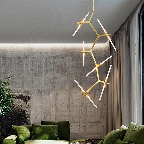 Xylin 2 Candelabra Chandelier in gold hanging in a Nigerian staircase