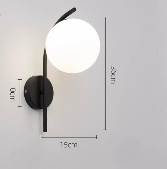 Close-up of Miira Wall Light showing mouth-blown glass detail