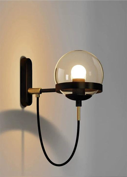Retro 3D Wall Light in gold mounted on a Nigerian stairway wall