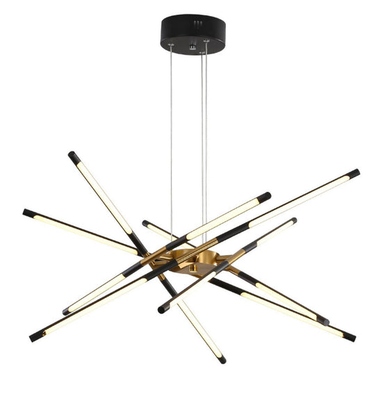 Spider Chandelier Light with angular gold arms hanging in a Nigerian living room