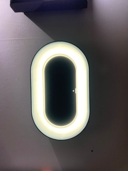 Outdoor wall light mounted beside an exterior staircase in Nigeria