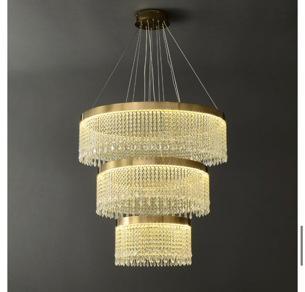 3-Step Luxury Crystal Chandelier with tiered crystal design above a dining table