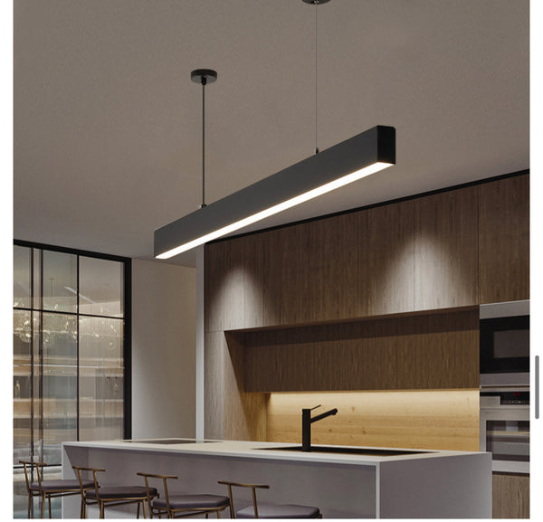 LED Long Strip Chandelier hanging above a dining table in Nigeria
