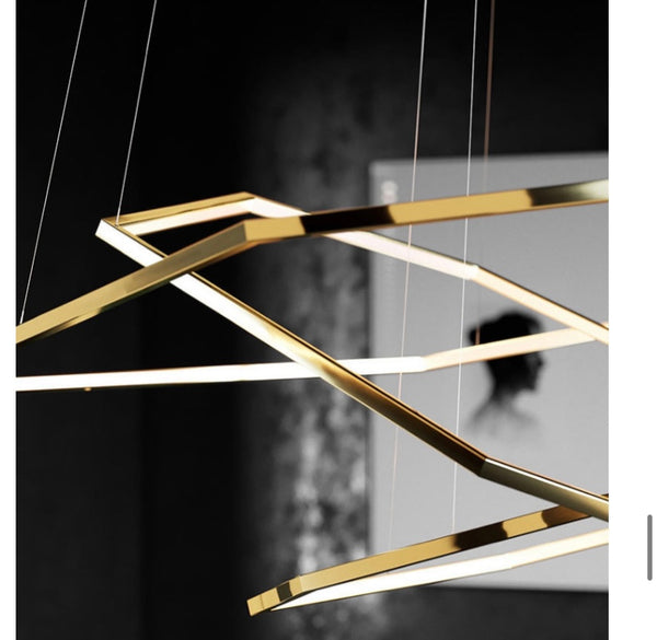 Gold Steel Trichromatic Chandelier installed in a Nigerian dining room ceiling