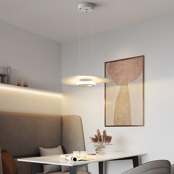 Potter Chandelier illuminated in a modern Nigerian living room