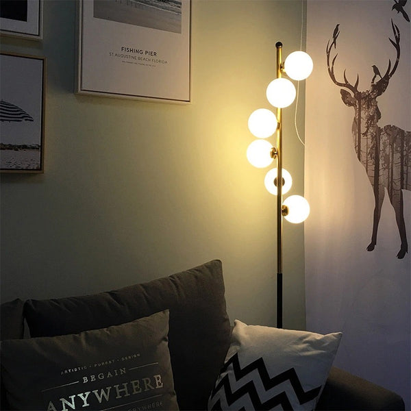 Post-Modern Nordic Floor Lamp styled beside a reading chair in Nigeria