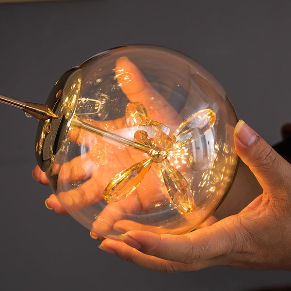 Close-up of Post-Modern Gold Chandelier showing copper globe detail
