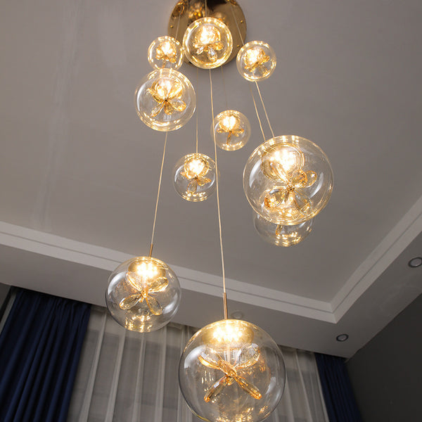 Post-Modern Gold Chandelier with 15 head globes hanging in a Nigerian staircase void