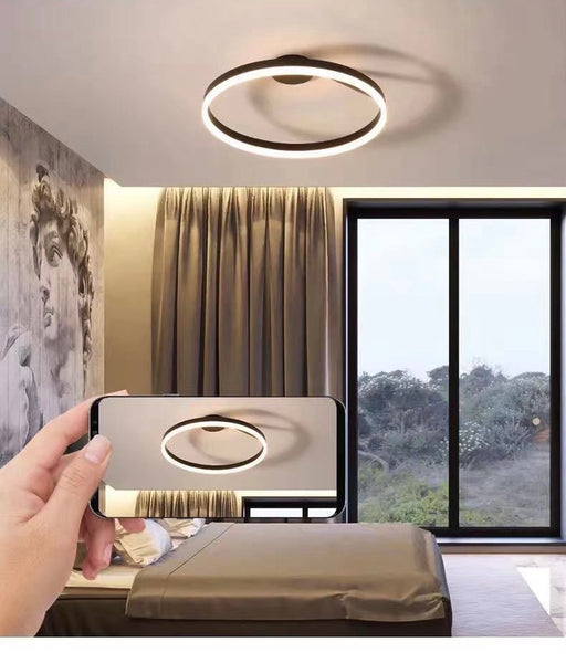 Nordic Ring LED Flush Light illuminated in a Nigerian bedroom