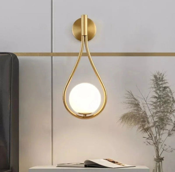 Indoor wall light mounted beside an interior staircase in a Nigerian home