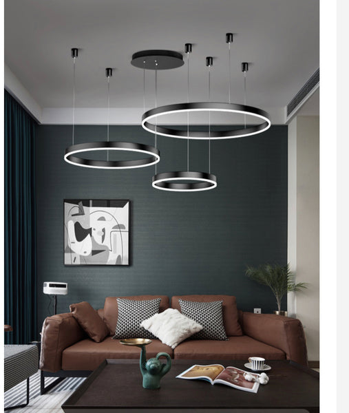 Circa Chandelier hanging above a dining table in a Nigerian home
