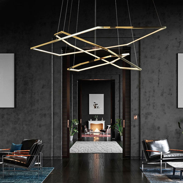 Gold Steel Trichromatic Chandelier hanging above a dining table