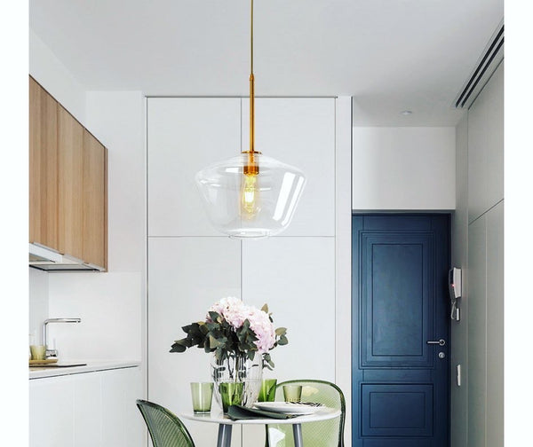 Big Amber Bowl Droplight with oversized amber glass bowl above a dining table