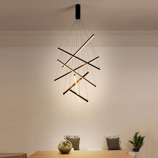 7 X 100 LED Ceiling Chandelier with seven light heads hanging in a Nigerian living room