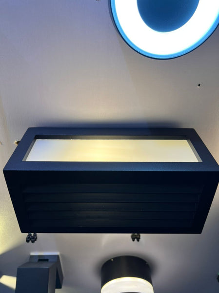 Close-up of outdoor wall light showing weatherproof housing