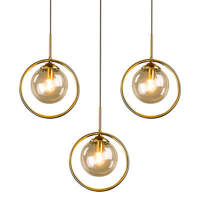 Amber Chandelier with warm amber glass shades hanging above a dining table
