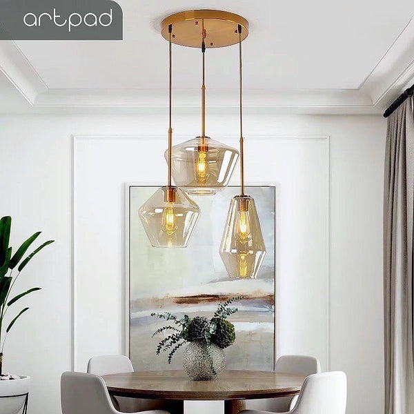 3-in-1 Amber Glass Droplight with cluster of amber glass shades above a dining table