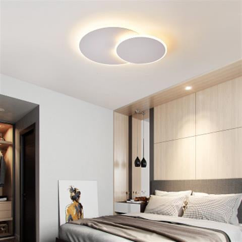 Round Modern Minimalist Ceiling Light illuminated in a Nigerian living room