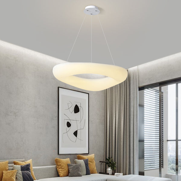 Doughnut Trichromatic LED Chandelier with ring-shaped design hanging in a Nigerian living room