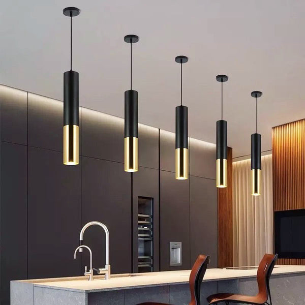 Black and Gold Tube pendant light illuminated in a Nigerian kitchen