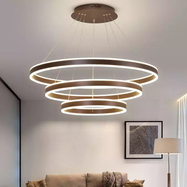 Close-up of Brusque Circle Rings chandelier showing gold ring layers and LED bulbs