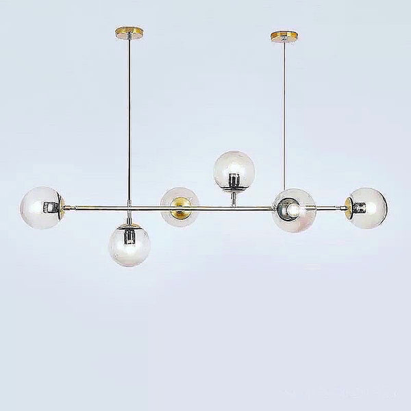 Buick Chandelier LED light with modern frame hanging above a Nigerian dining table