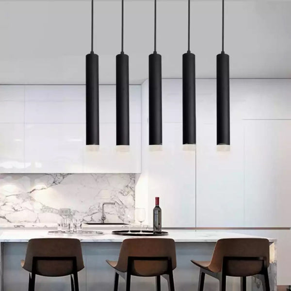 Criss Black Tube pendant light installed in a modern Nigerian dining room