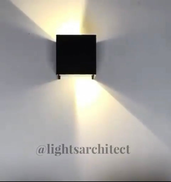 Close-up of Cubic Adjustable wall light showing adjustable cube head design