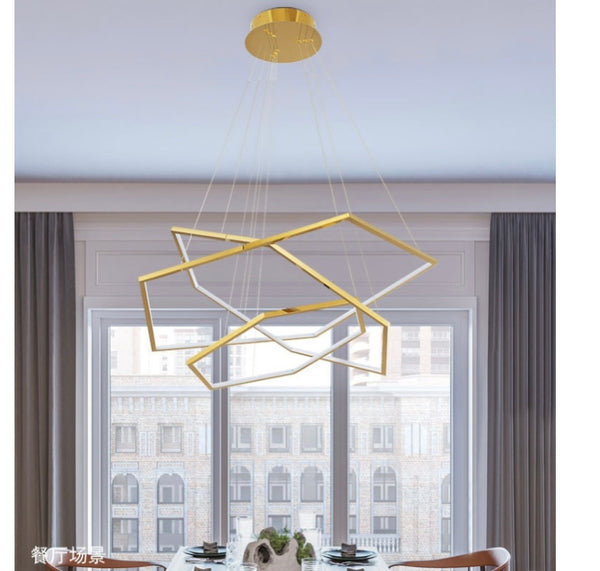 Gold Steel Trichromatic Chandelier illuminated in a Nigerian living room