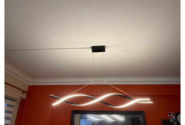 Italian Crisscross Ring Chandelier illuminated in a modern Nigerian dining room