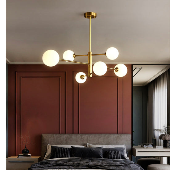 Creative Head Chandelier with artistic multi-head design hanging in a Nigerian living room
