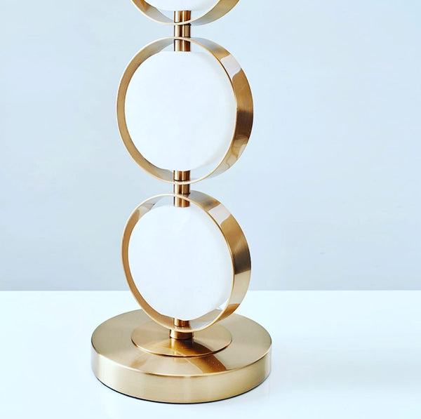 Golden Ball Table Lamp illuminated on a bedside table in a Nigerian bedroom