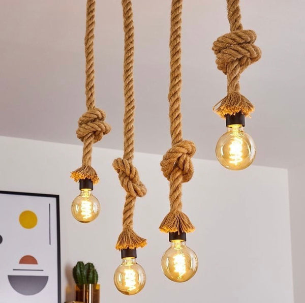 Rattan Hemp Droplight with handwoven natural rattan shade above a dining table