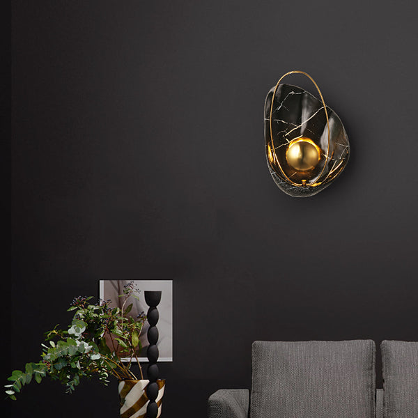 Shell wall light installed beside a mirror in a Nigerian bedroom