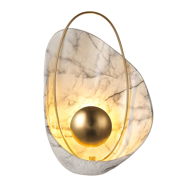 Shell-shaped wall sconce illuminated in a modern Lagos hallway