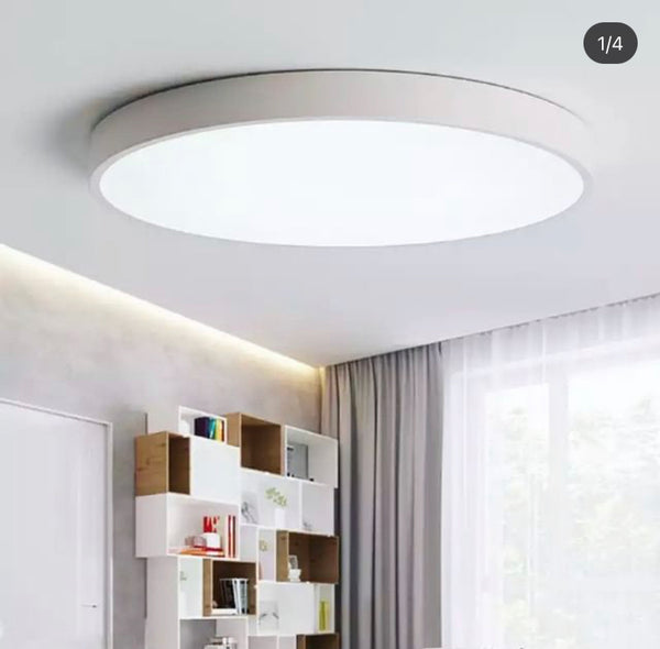 Close-up of Circle Geometry ceiling flush light showing gold ring frame and LED diffuser