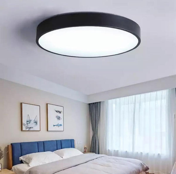 Circle Geometry gold ring LED ceiling flush light mounted on a Nigerian bedroom ceiling