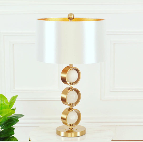 Golden Ball Table Lamp styled in a modern Lagos living room