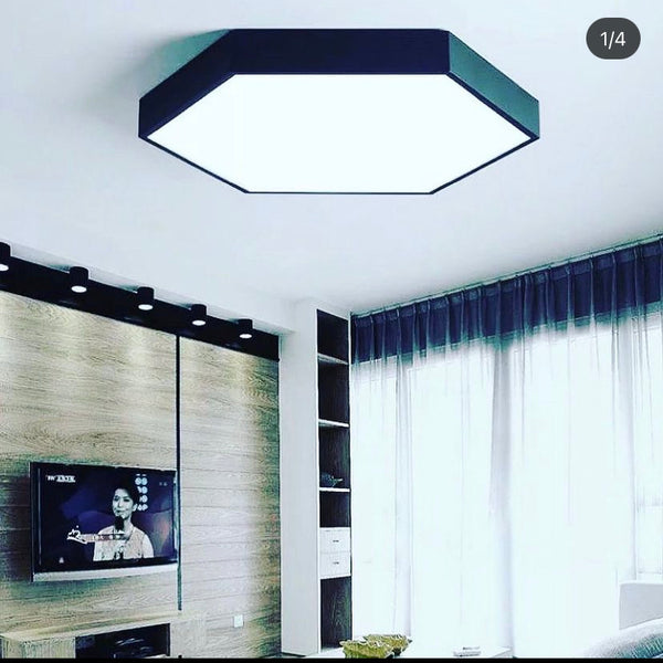 Hexagon-shaped LED ceiling flush light close-up showing gold trim and light diffuser